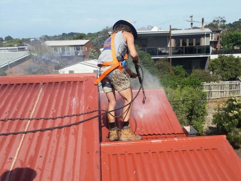 Powder coating removed from metal roof surface