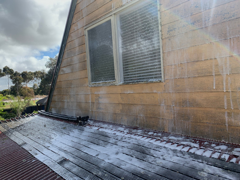 Black stains disappearing after moss treatment on roof