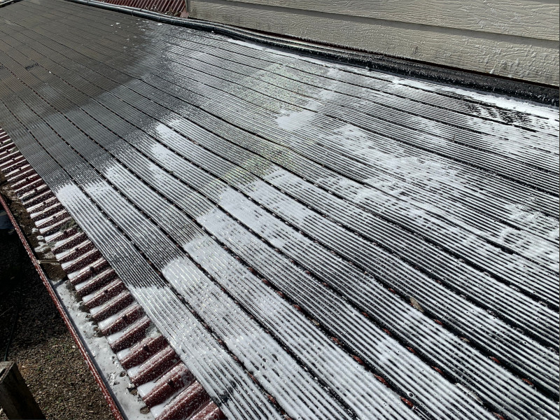 Moss Roof Treatment applied to pool heating system