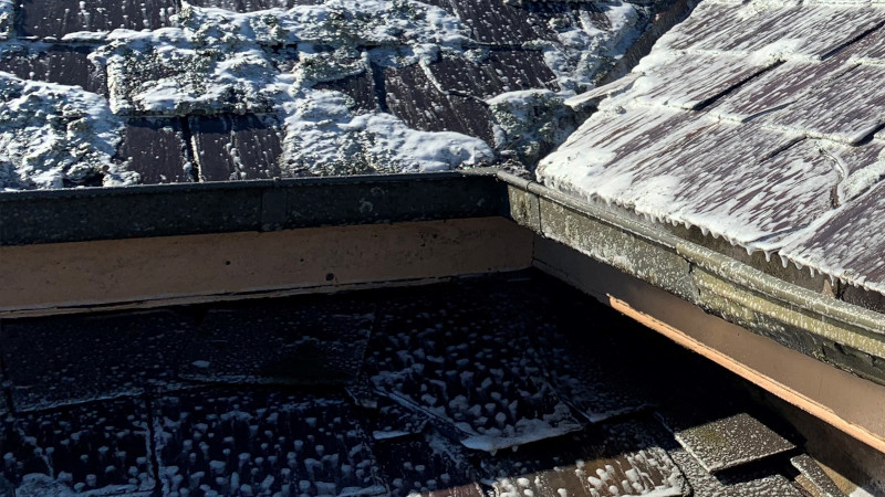 Broken ridge cap on a cement roof needing repair