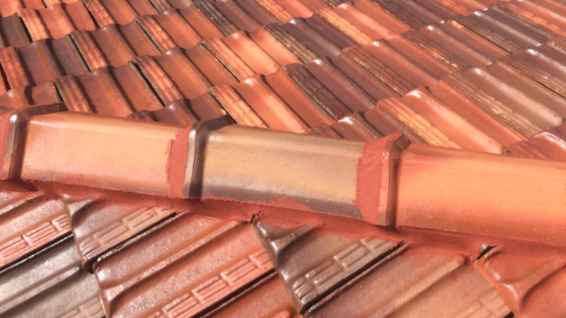New flexi-point ridge caps installed on a terracotta roof