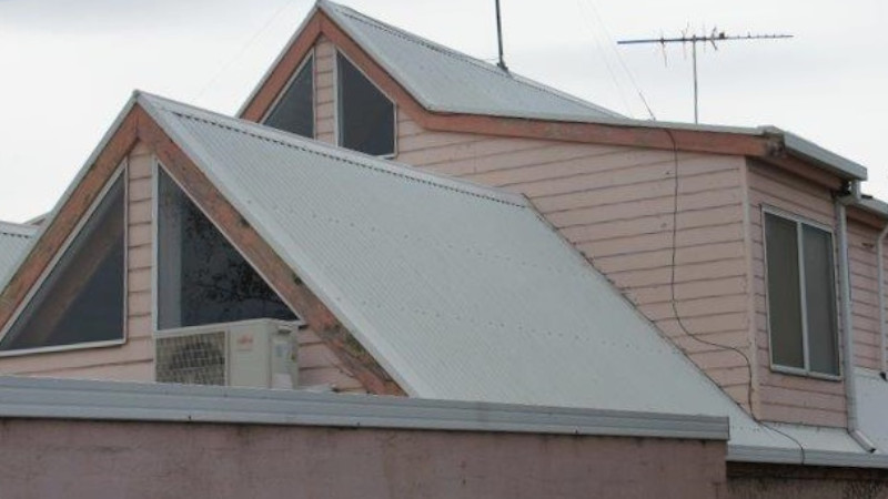 Steep Colorbond roof after moss treatment showing a clean surface