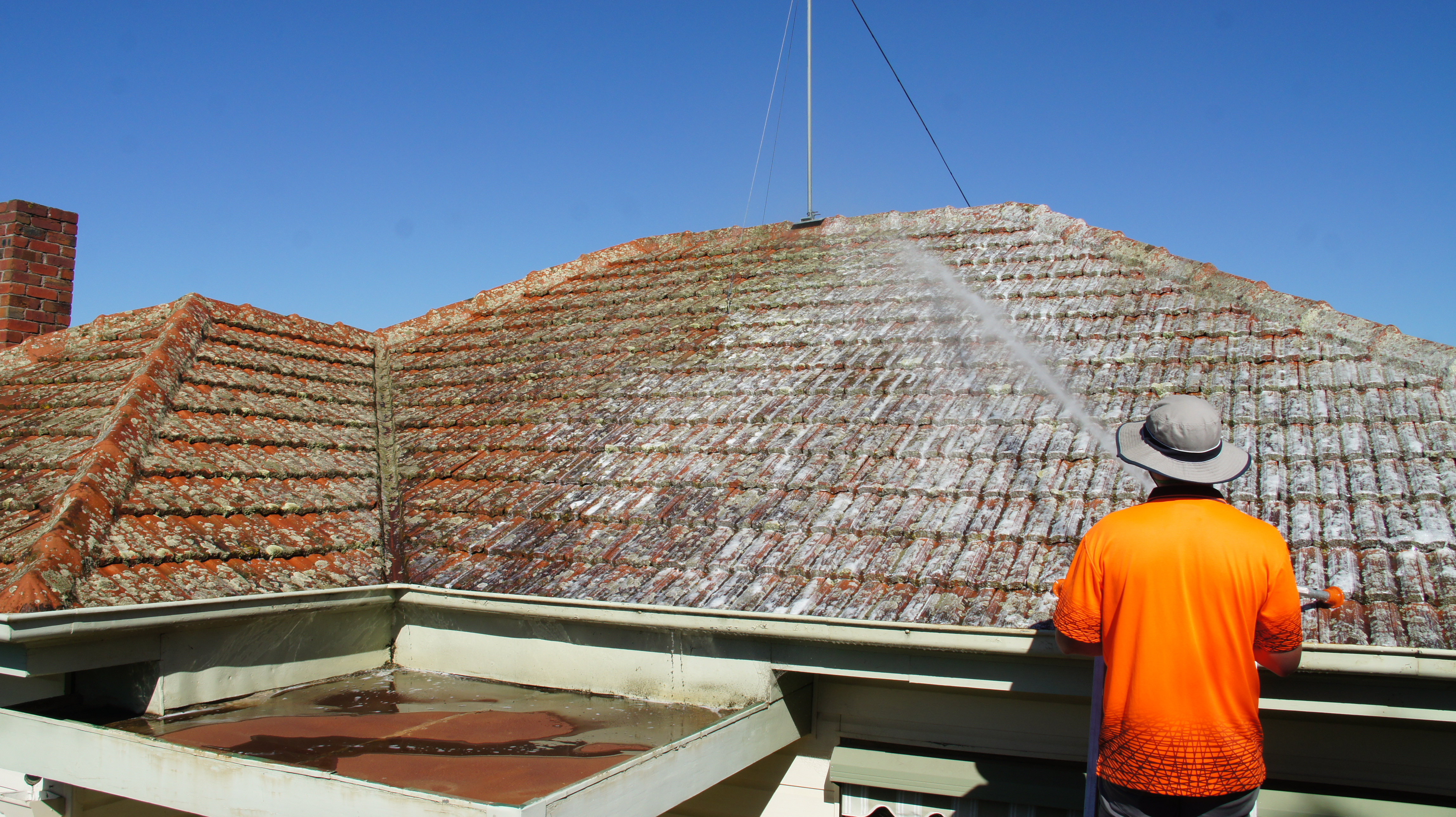 Moss flaking and breaking down on a cement roof